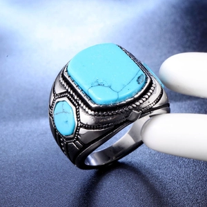 Polished men's stainless steel signet ring with a large rectangular turquoise stone
