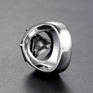 Detailed close-up of retro titanium steel men's ring with inner forest pine tree carving