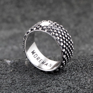 Industrial punk titanium steel ring with textured dots and Moreman engraving