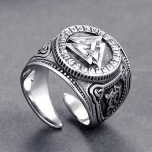 Detail of Viking Valknut ring with engraved runes and adjustable vintage steel band