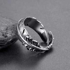 Macro shot of vintage feather ring detail with intricate antique silver texture