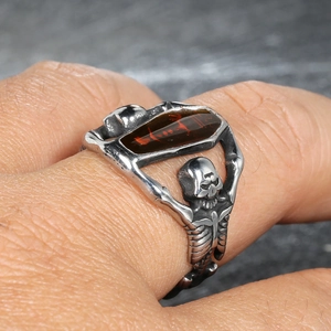 Vintage punk vampire ring featuring dual skeletons holding a coffin-shaped amber stone