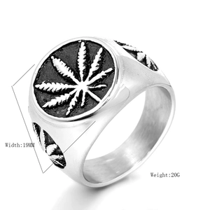 Macro shot of silver maple leaf ring featuring 19mm width and 20g weight specs