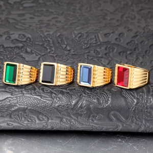 Set of four men's gold plated stainless steel rings with colorful zircon gemstones