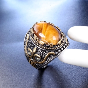 Retro punk men's stainless steel ring featuring oval tiger eye stone and gold floral motifs
