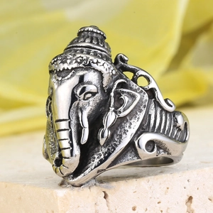 Macro view of vintage stainless steel elephant ring with detailed Ganesha carvings