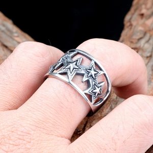 Detailed view of hollow star pattern on vintage silver titanium steel ring for men