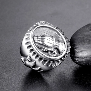 Gothic punk titanium steel ring featuring praying hands and cross on black stone