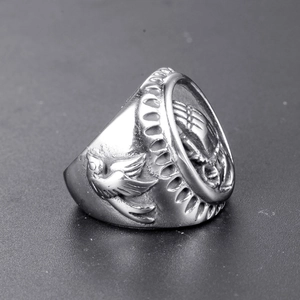 Vintage silver punk ring featuring praying hands relief and flying bird side carvings