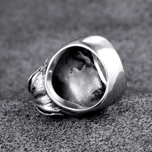 Macro detail of lion head ring side profile and smooth inner band in retro silver finish