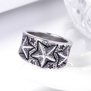 Vintage oxidized silver pentagram star ring with embossed details and hammered texture