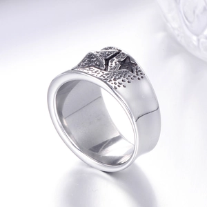 Detail view of pentagram engraved ring with vintage black textured grain and polished finish