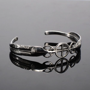 Vintage stainless steel feather bracelet for men featuring an antique silver finish