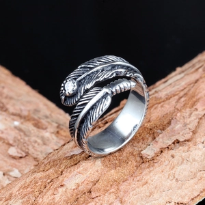 Vintage silver feather open ring with white zircon on rustic wooden bark display
