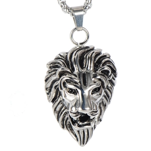 Close-up of vintage lion head pendant in polished titanium steel with antique finish