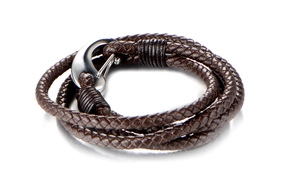 Detailed view of dark brown braided leather bracelet with silver stainless steel hook clasp