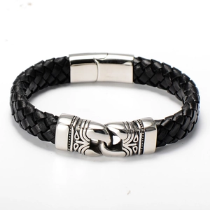 Close-up of black braided leather bracelet with vintage silver-tone magnetic clasp
