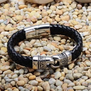 Men's black braided leather bracelet with stainless steel magnetic clasp on stone background