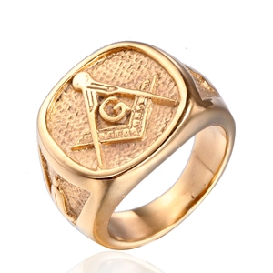 Golden titanium steel Masonic ring for men featuring a G symbol and textured shield face