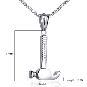 Macro shot of silver hammer pendant dimensions 47mm by 28mm with polished metal finish