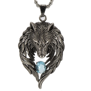 Macro detail of wolf head pendant with blue gemstone and realistic metal fur texture