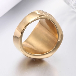Detailed macro view of gold-plated Masonic ring showing brushed inner surface and polished edge