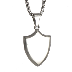 Close-up of polished 316L stainless steel shield pendant with silver box chain detail
