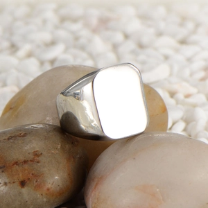 Polished titanium steel signet ring for men with a solid flat rectangular surface