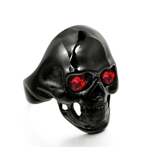 Vintage gothic men's black stainless steel ring with red eye skull design on white background