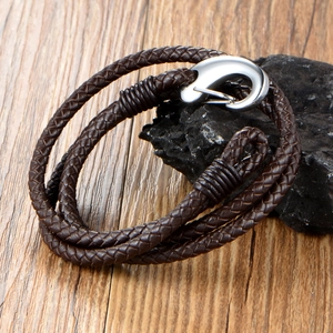 Braided dark brown leather wrap bracelet featuring a polished silver fishhook clasp on stone