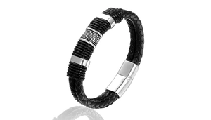 Detailed macro view of black braided leather bracelet with stainless steel magnetic clasp