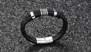 Close-up of black braided leather bracelet with silver stainless steel magnetic clasp