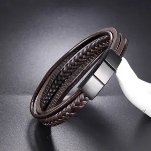 Detail of adjustable dark brown braided leather multilayer bracelet with matte black metal clasp