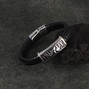 Men's braided black leather bracelet with stainless steel magnetic clasp and flame motif