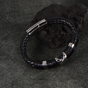 Men's black braided leather bracelet with silver magnetic clasp and geometric fox charm