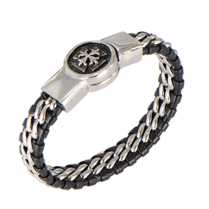 Macro shot of men's vintage woven leather bracelet with silver Maltese cross clasp
