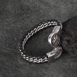Men's braided leather bracelet with silver metal chain and engraved cross clasp