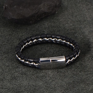 Men's black braided leather bracelet with silver chain accent and polished steel clasp