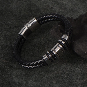 Men's woven black leather bracelet with silver stainless steel magnetic clasp on stone