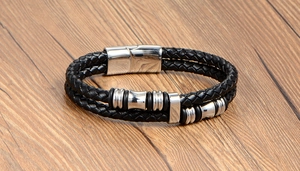 Close-up of black double-layered braided leather bracelet with stainless steel clasp