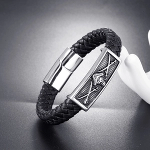 Men's woven black leather pirate bracelet with skull charm and magnetic metal clasp