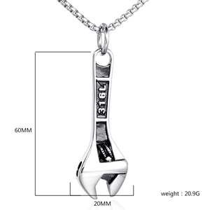 Macro detail of 316L stainless steel wrench pendant necklace showing 60mm height measurement