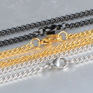 Men's stainless steel curb chains in silver, gold, and black finishes with lobster clasps