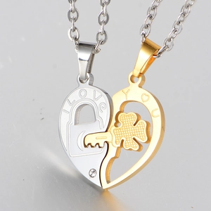 Polished stainless steel couple's heart necklace set with engraved I Love You and clover key
