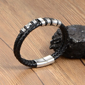 Minimalist black braided leather bracelet with polished steel beads and magnetic clasp