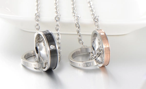 Detail of double ring couple necklace with 'Eternal Love' engraving and zircon inlay