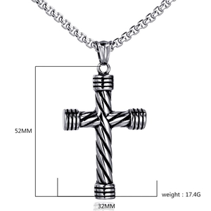 Close-up of gothic punk twisted cross pendant with dimension specs on white background