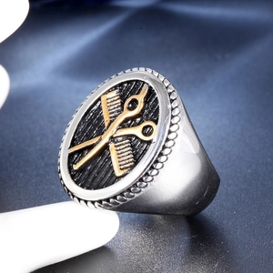 Men's stainless steel signet ring featuring golden barber scissors and comb on blue base