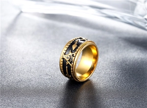 Detail of vintage Masonic ring showing gold Freemasonry G symbol on black stainless steel