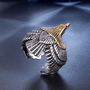 Close-up of eagle ring showing detailed feather textures and golden eagle head